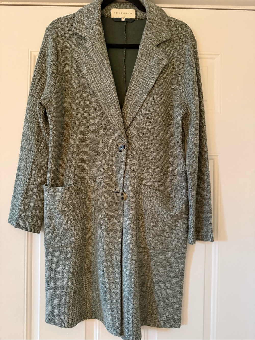 Green trenchcoat sweater